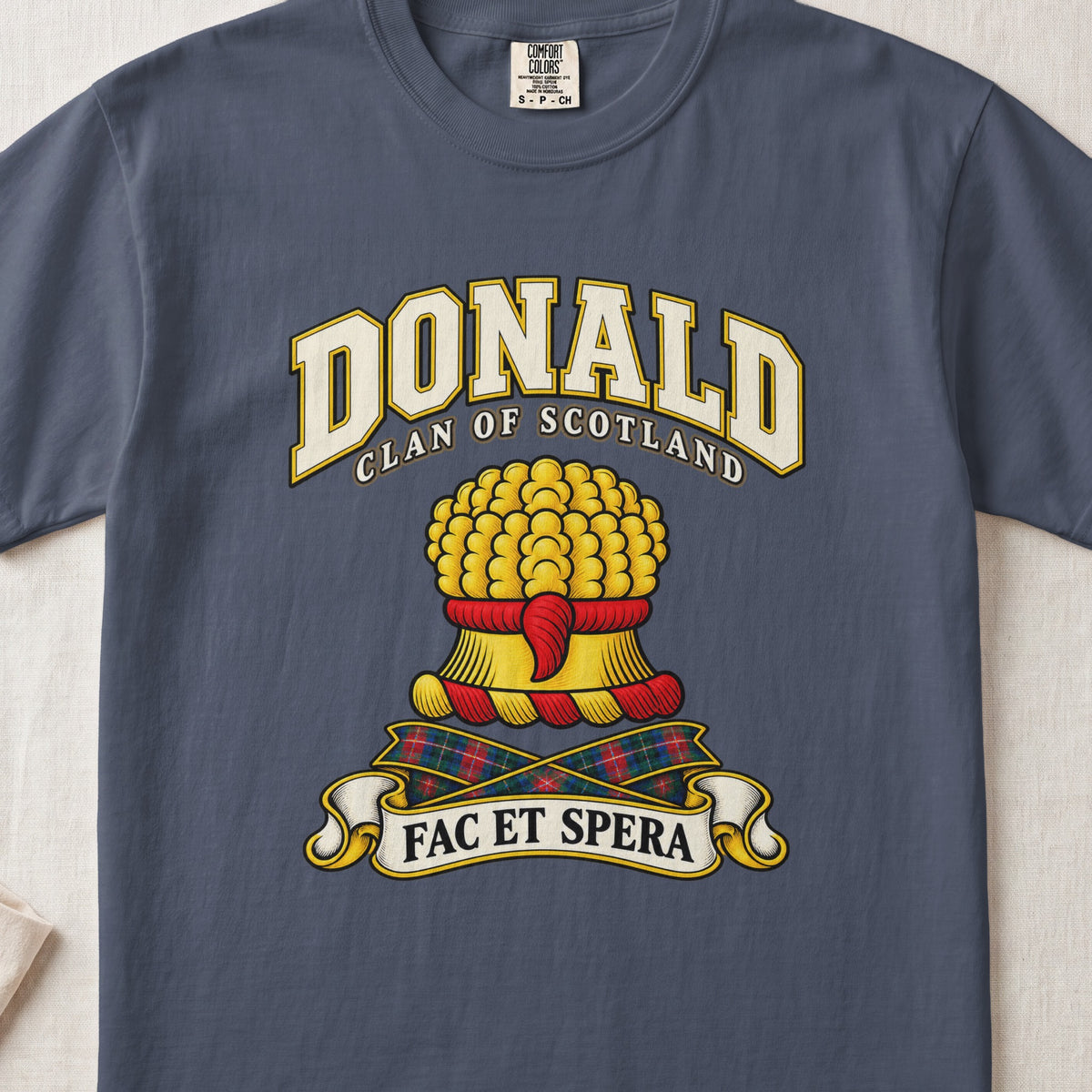 Donald Scottish clan T-shirt in Midnight, front view with a gold sheaf of wheat and motto banner.