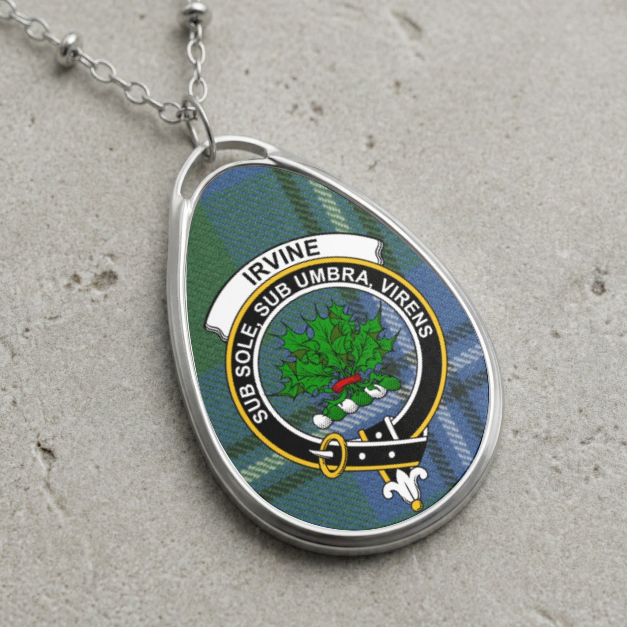 Irvine clan Scottish tartan necklace with clan crest and Sub Sole Sub Umbra Virens motto on tartan background