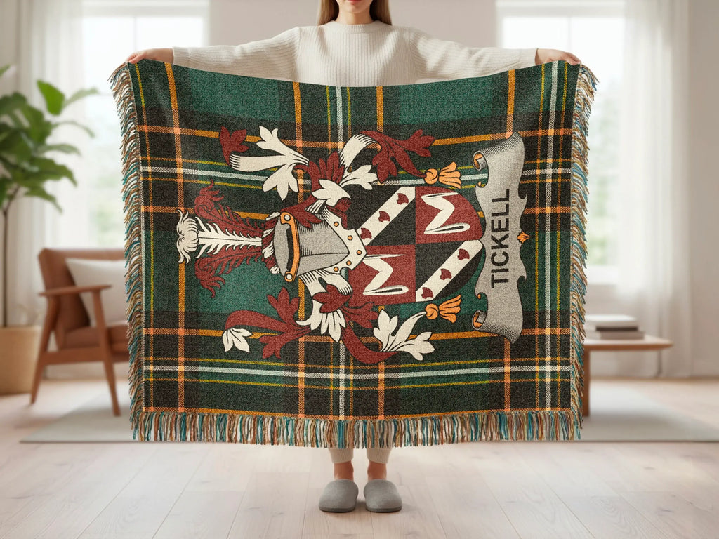 Tartan blanket with the Tickell family crest held by a person.