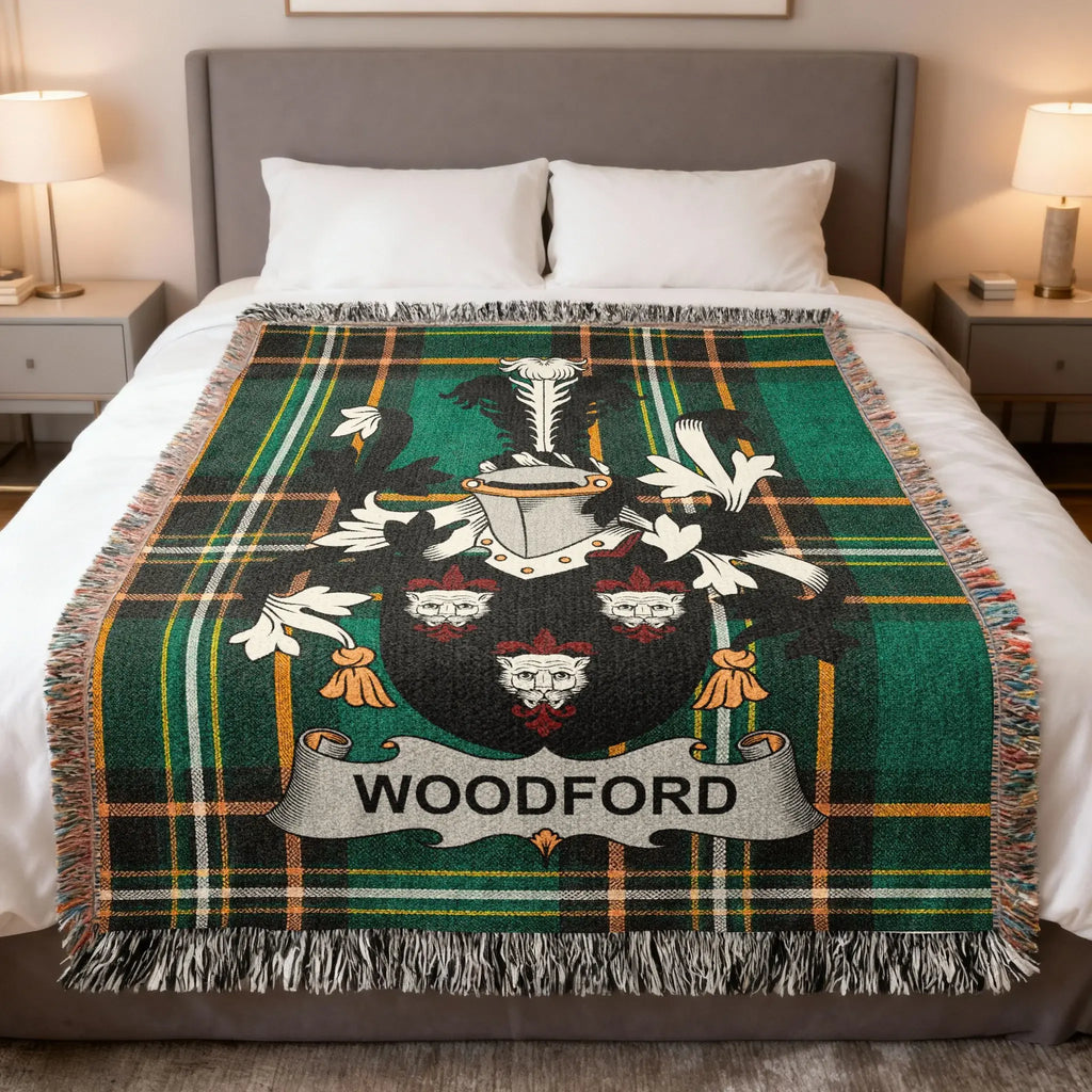 Green and black plaid blanket with Woodford family crest at center.