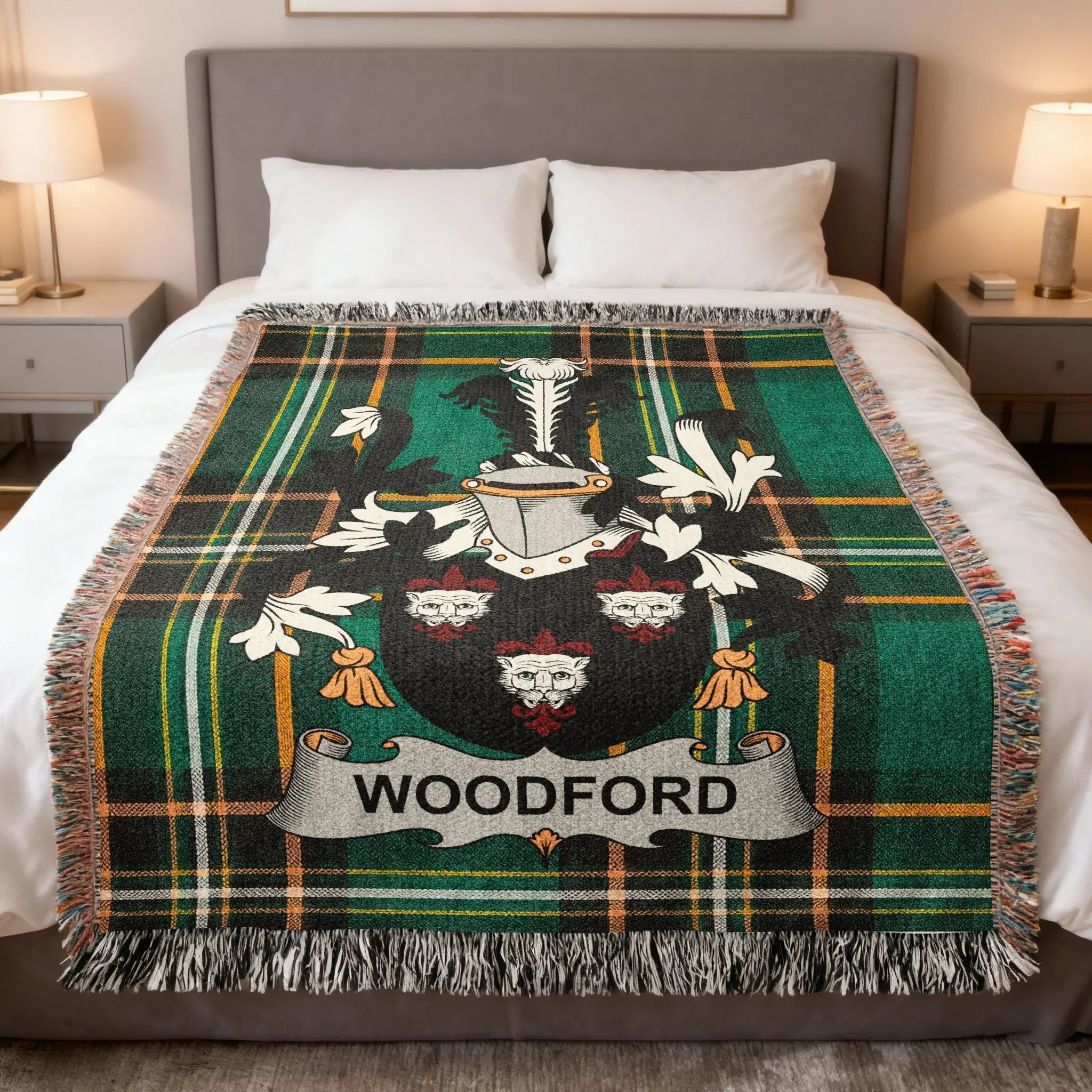 Green and black plaid blanket with Woodford family crest at center.