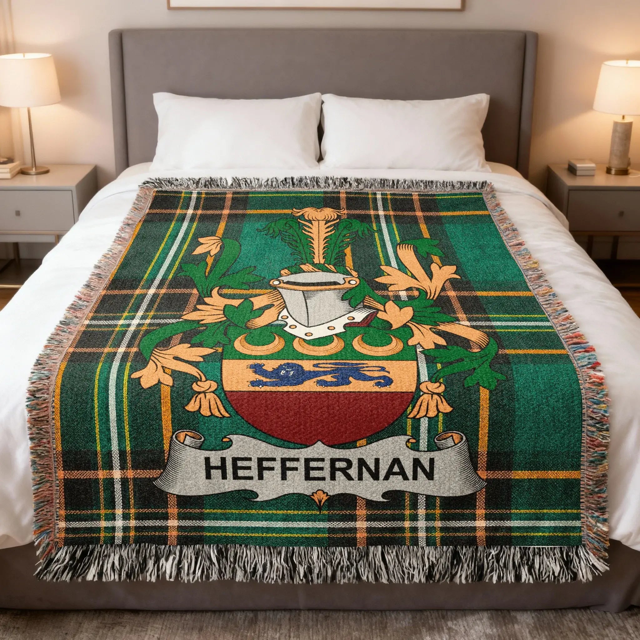 Tartan blanket with Heffernan family crest on a bed.