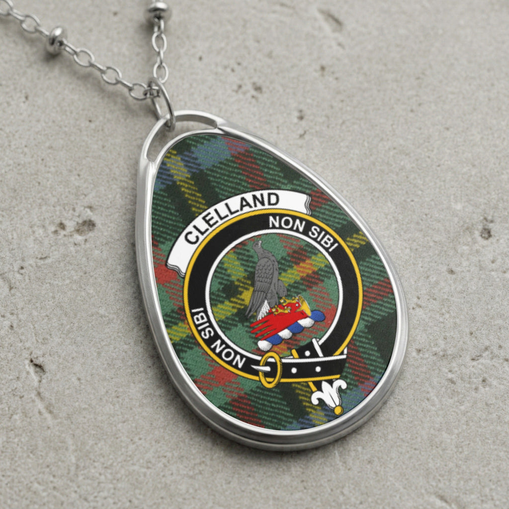 Clelland clan Scottish tartan necklace with clan crest and Non Sibi motto on tartan background