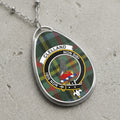 Clelland clan Scottish tartan necklace with clan crest and Non Sibi motto on tartan background