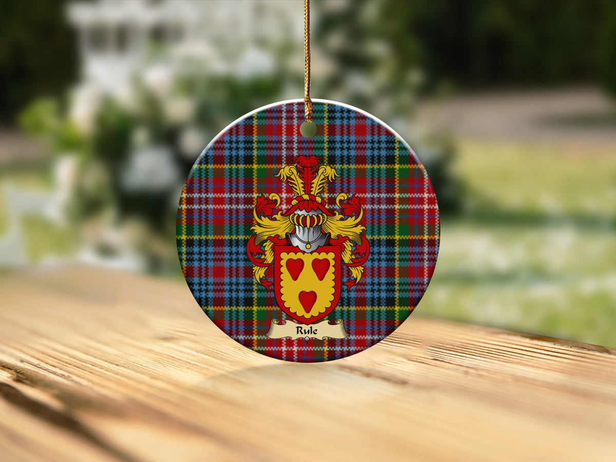 Round Rule Scottish clan ornament with family crest on a Caledonia tartan background