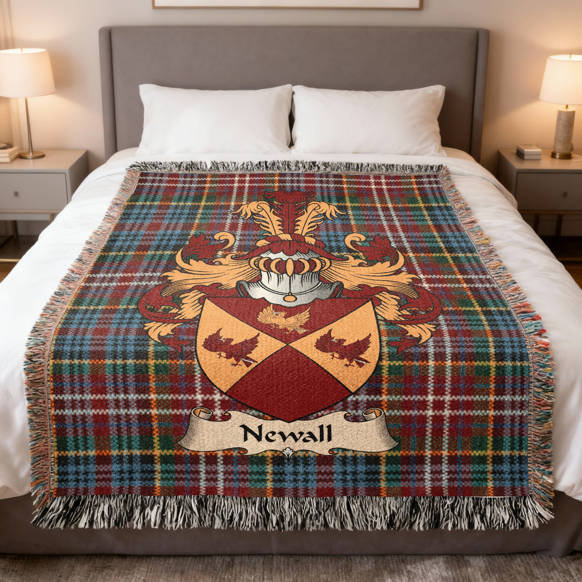 Newall family crest emblem on a Caledonia tartan woven blanket