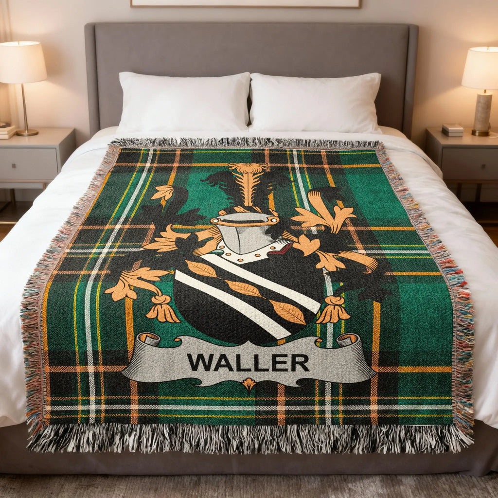 Tartan blanket featuring the Waller family crest on a bed.