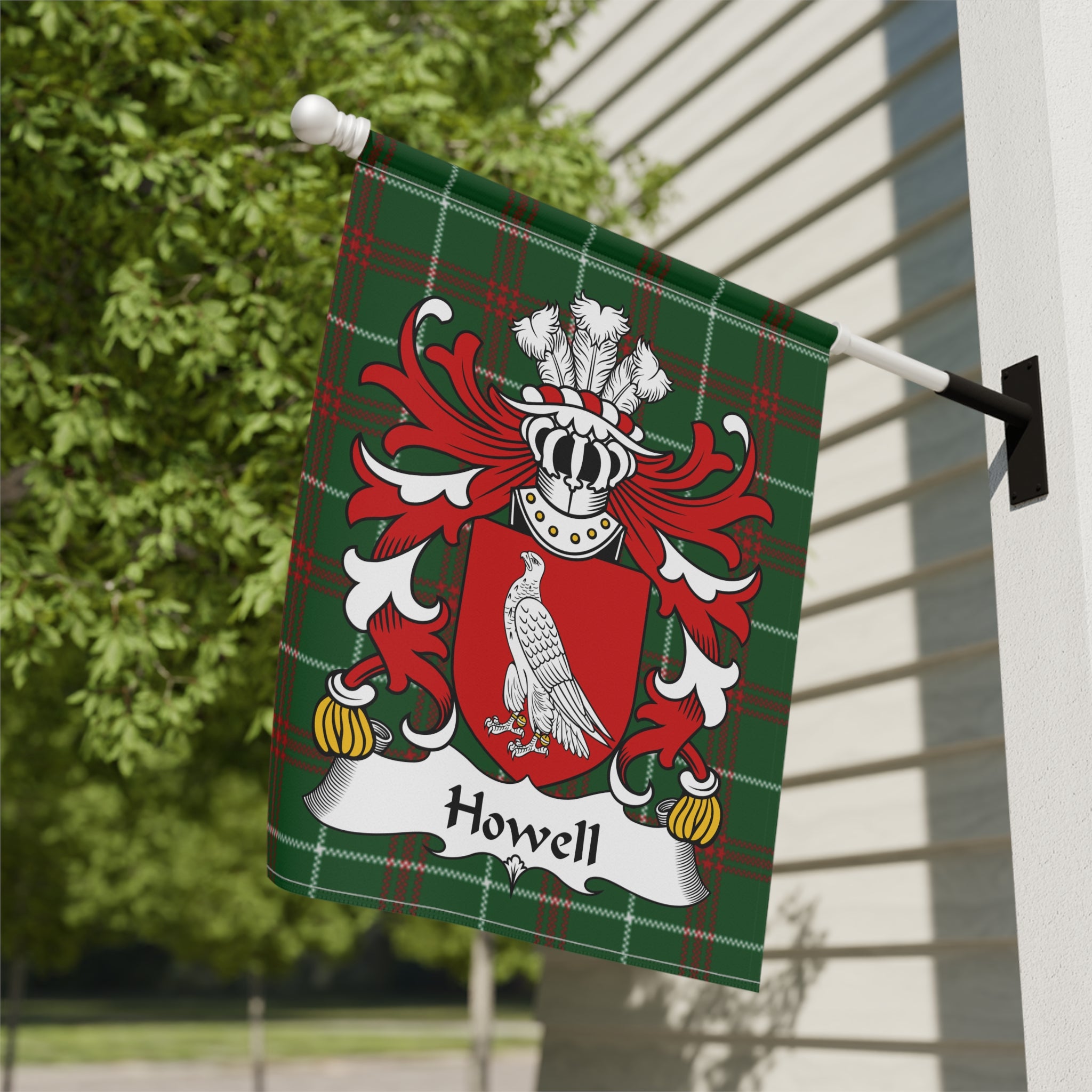 Green plaid flag displaying a red crest with white eagle and "Howell" banner.