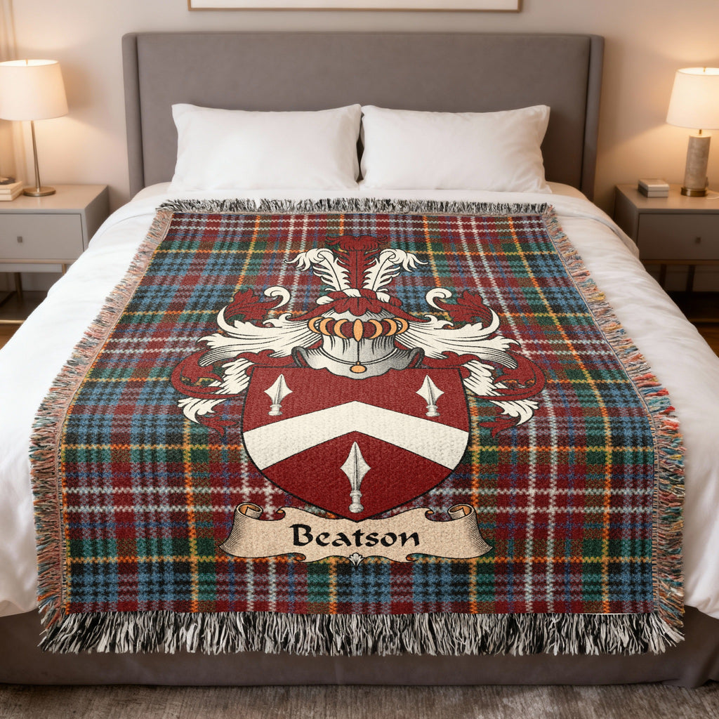 Beatson family crest emblem on a Caledonia tartan woven blanket