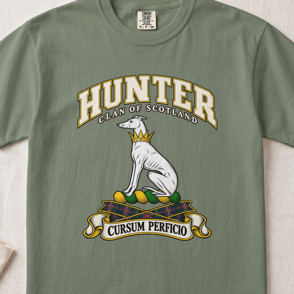 Hunter Scottish clan T-shirt in Moss, front view with a seated white hound with a golden collar and motto banner.
