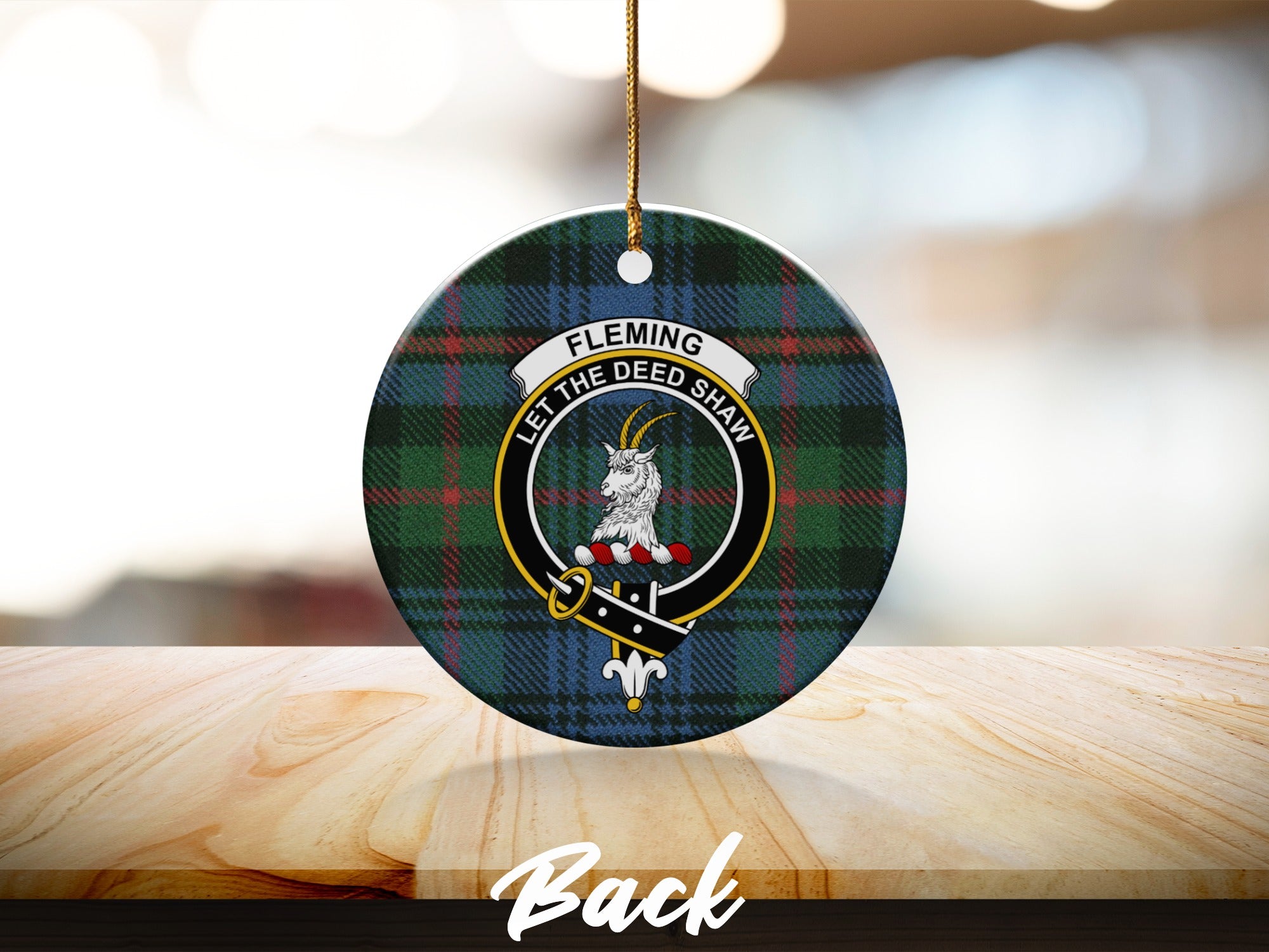 Fleming clan tartan ornament with gold hanging string on wooden surface