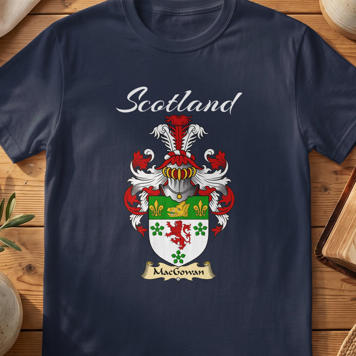 Navy MacGowan family shield T-shirt featuring a green-and-white shield with a red lion and clover motifs