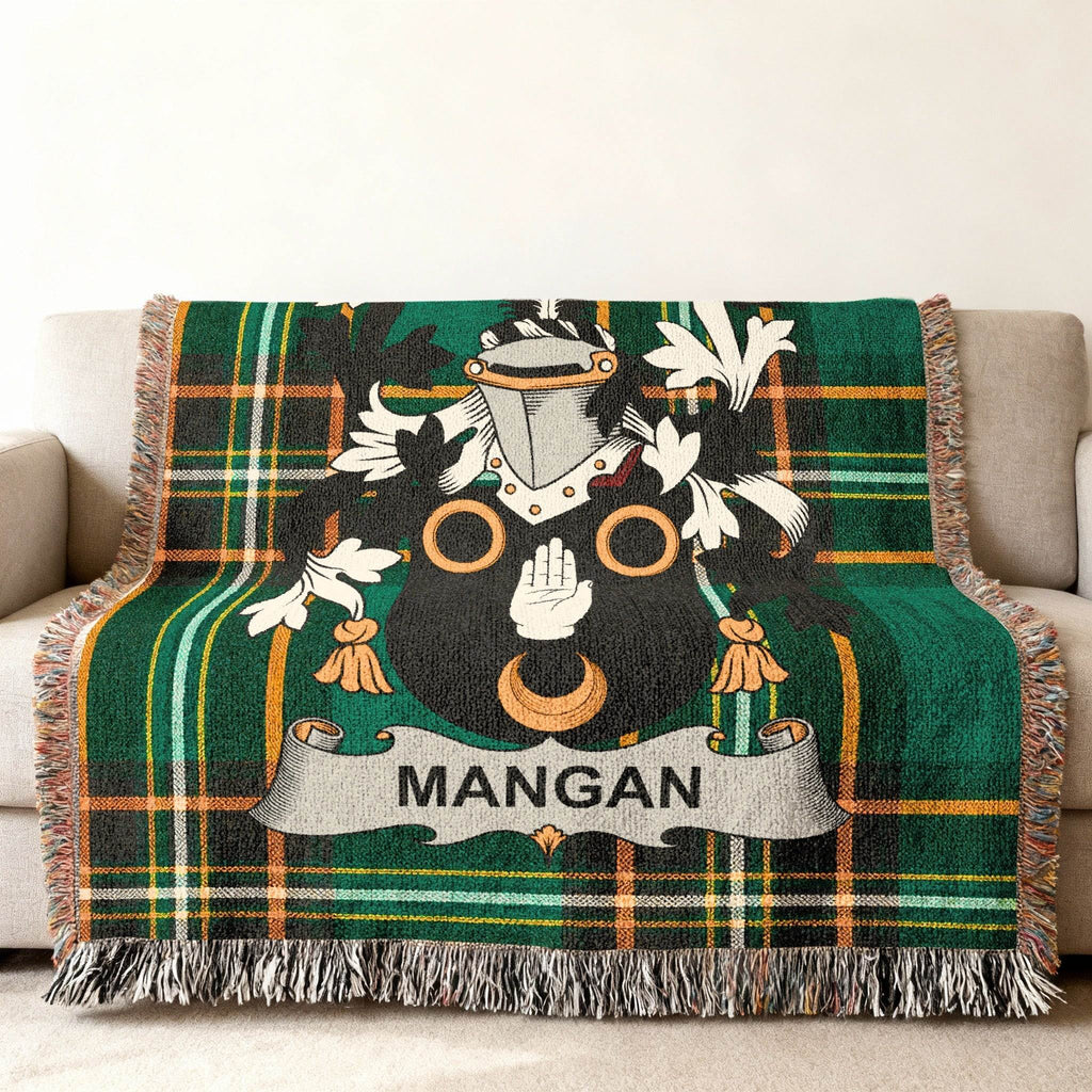 Green tartan throw blanket with the Mangan family crest.