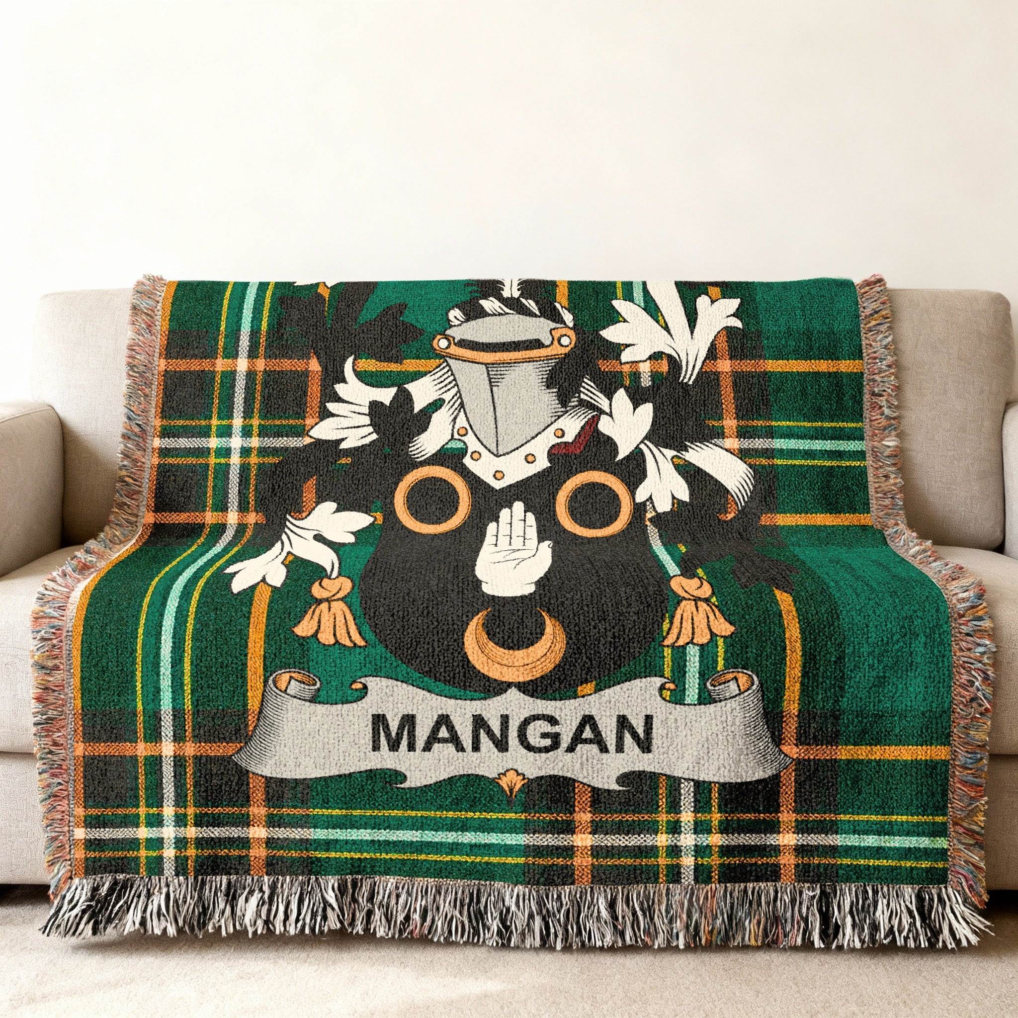 Green tartan throw blanket with the Mangan family crest.