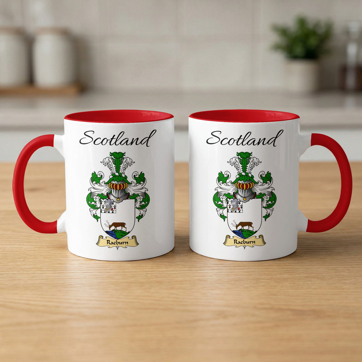 Red-accent Raeburn Scottish family crest mugs with Scotland above the heraldic shield