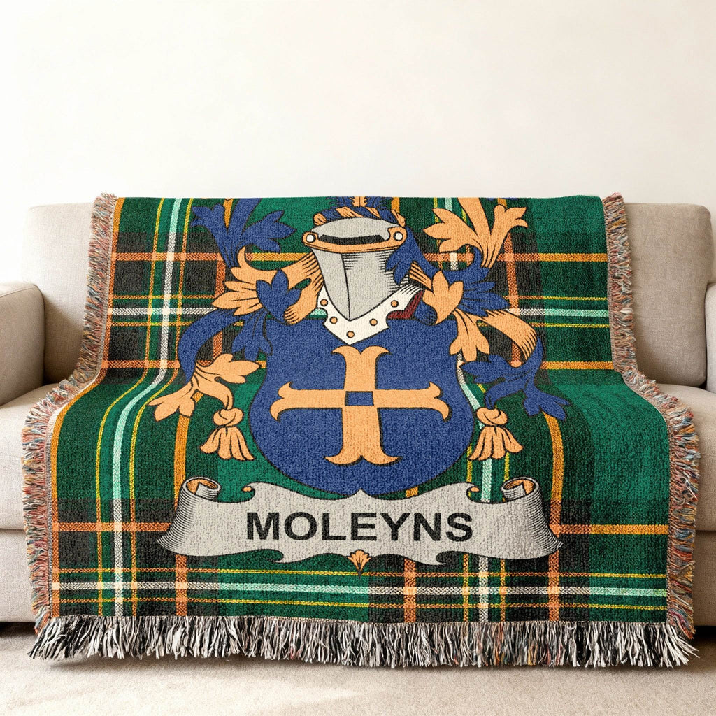 Woven tartan throw blanket with a blue and gold family crest and MOLEYNS name banner.