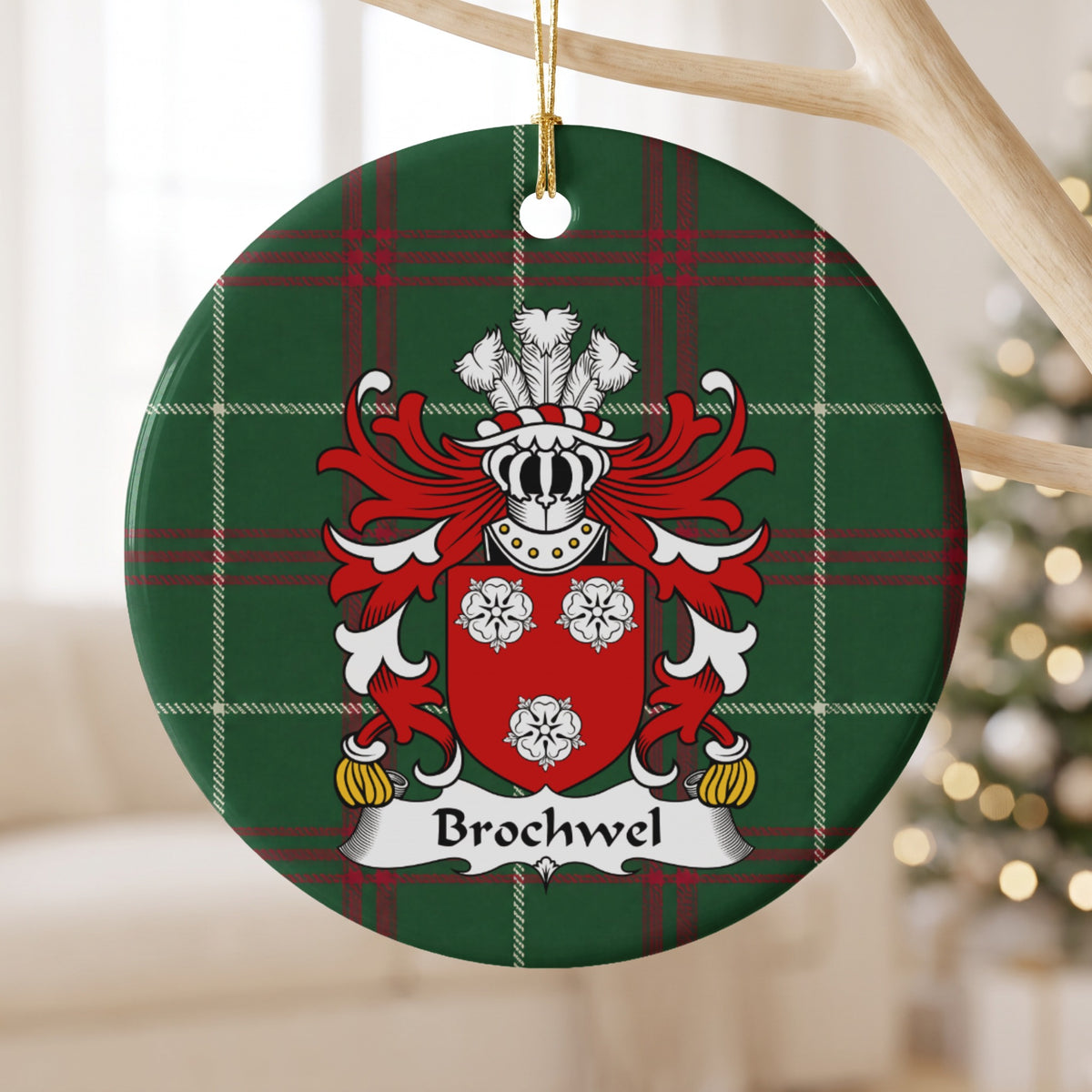 Brochwel Style 2 ornament hanging from a pale wooden branch; three white roses on a red shield on Welsh national tartan.