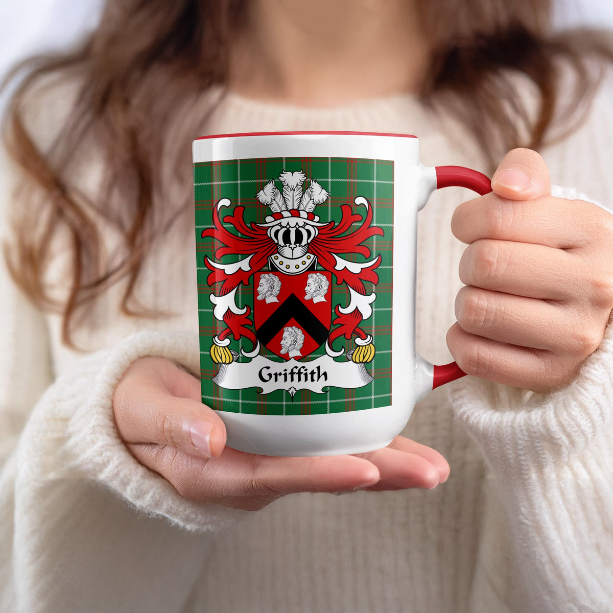 Mug with Griffith coat of arms and tartan pattern held by a person.