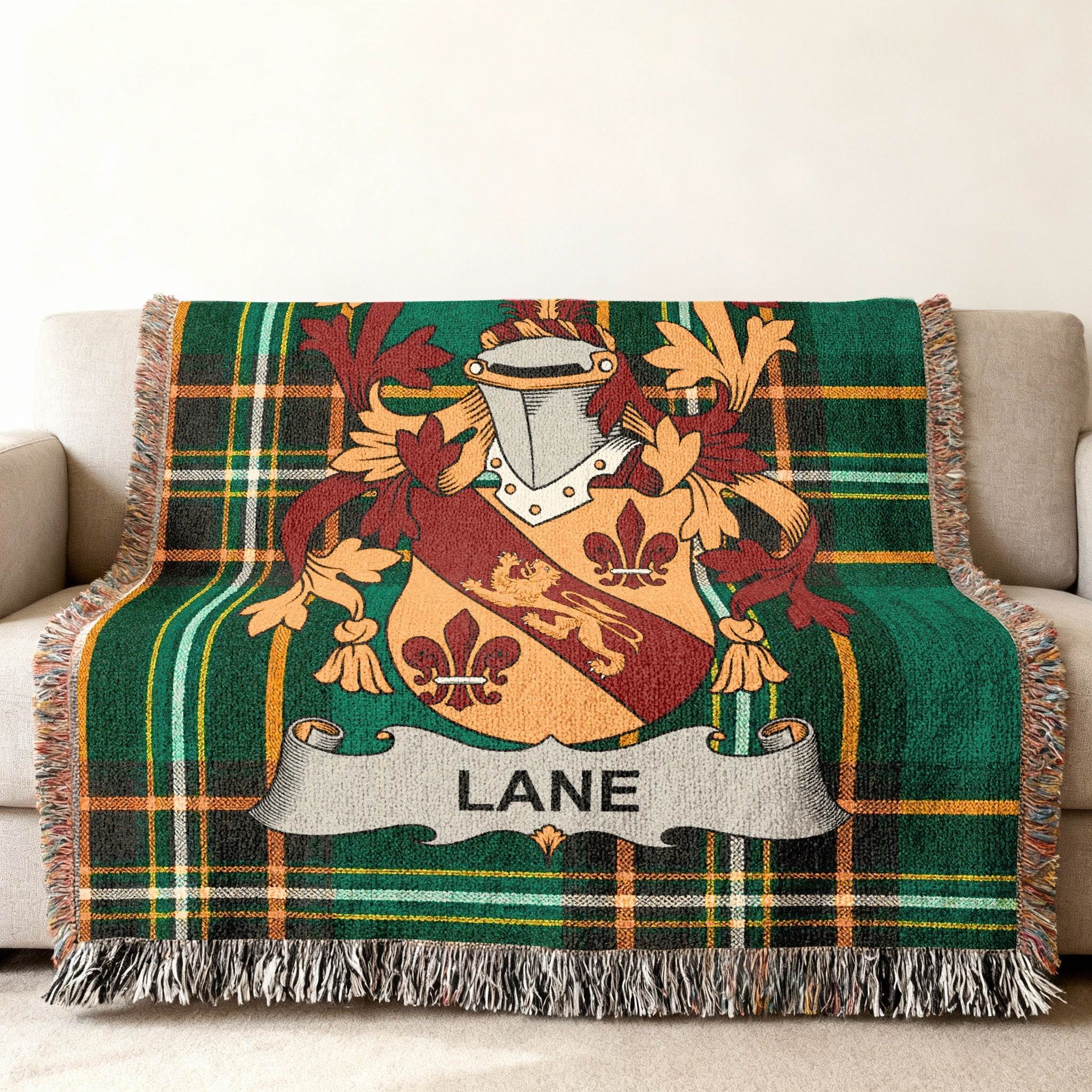 Green plaid blanket with Lane family crest and fringe.
