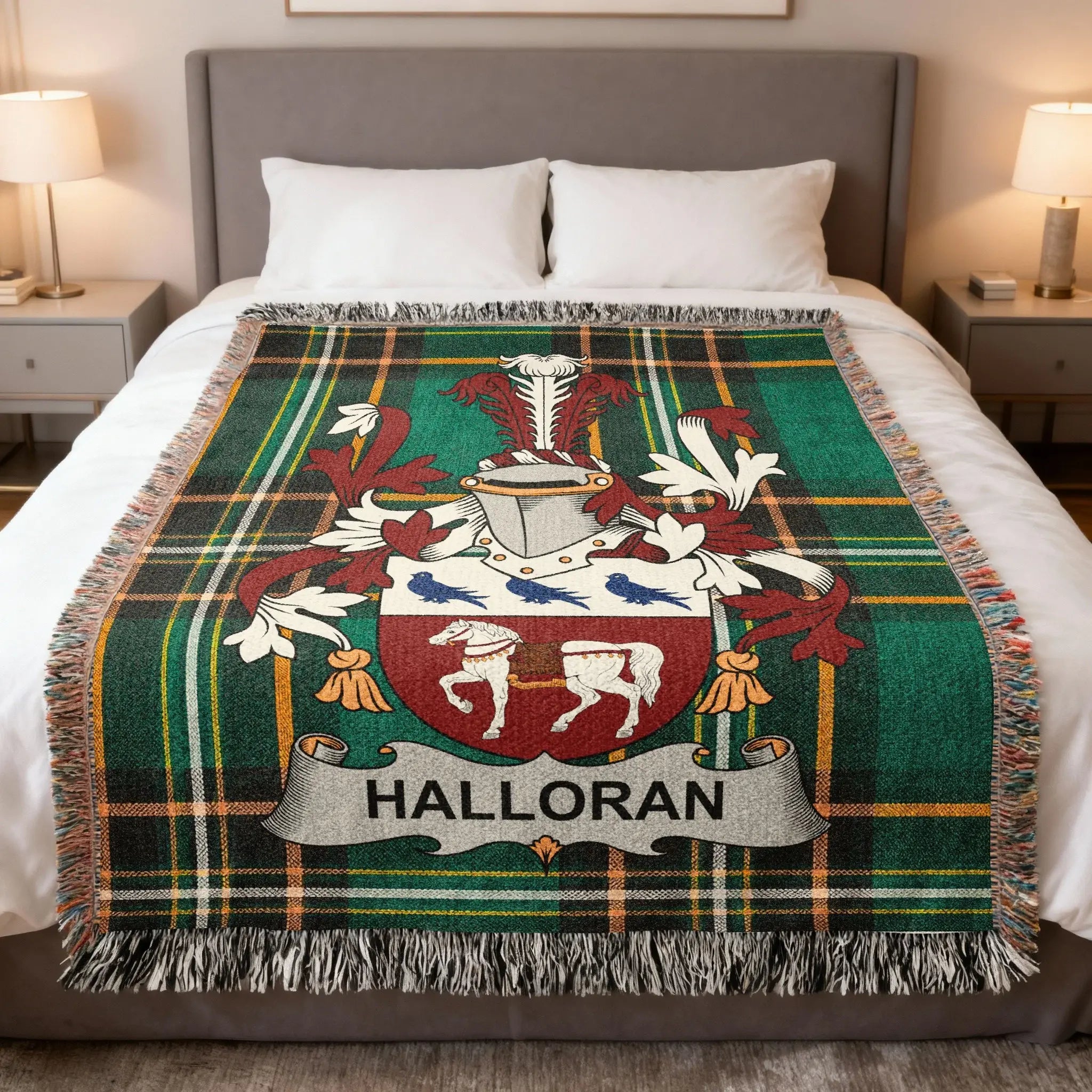 Halloran family crest on a green tartan blanket on a bed.