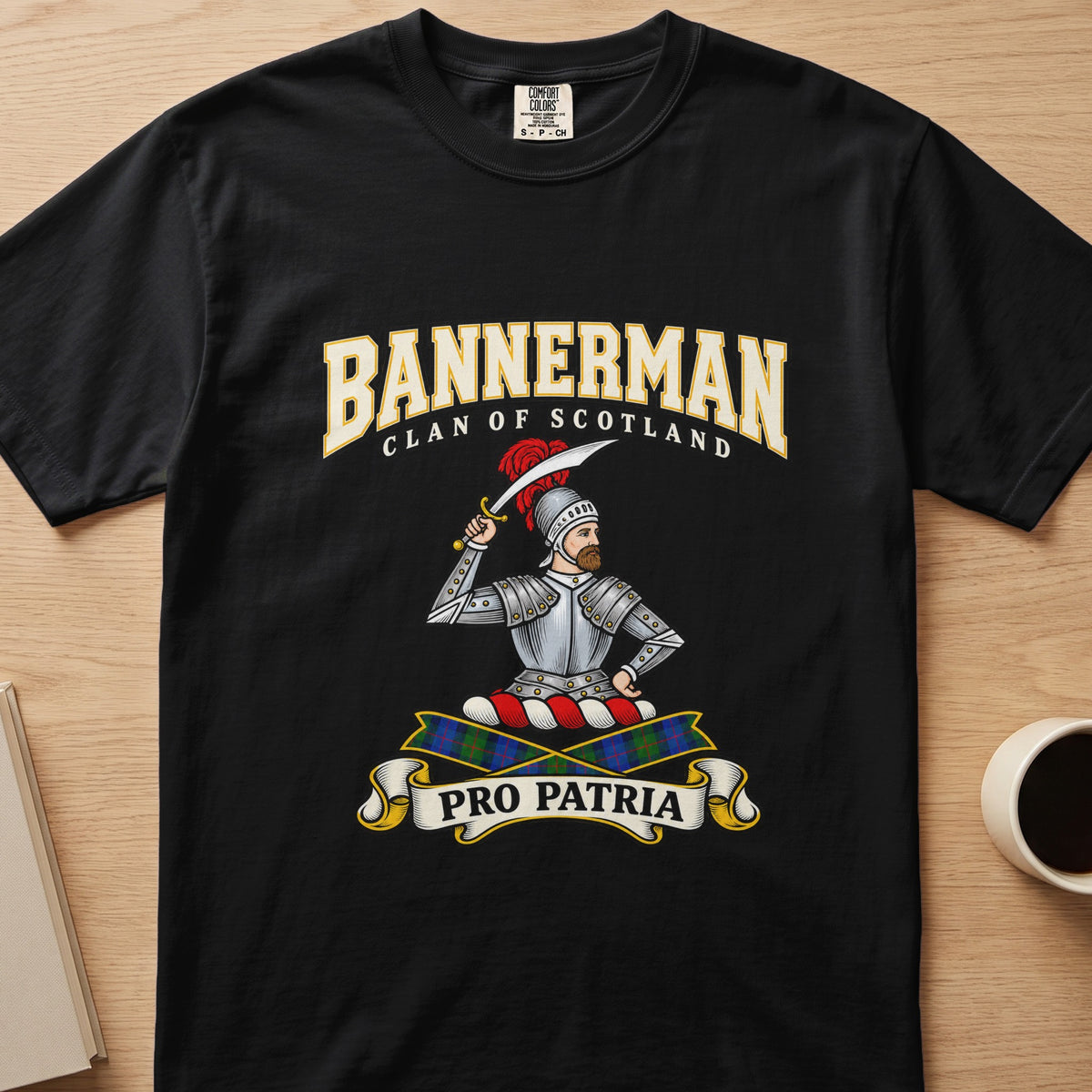 Bannerman armored figure and raised sword graphic on a black Comfort Colors T-shirt, front view