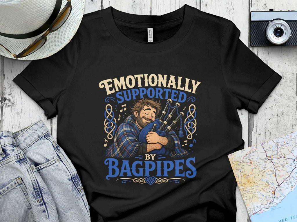 T-shirt with a man playing bagpipes, text reads "Emotionally Supported by Bagpipes".