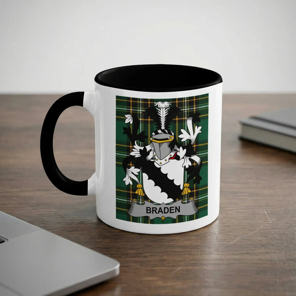 White mug with black rim featuring a coat of arms with the name "BRADEN" on a banner.