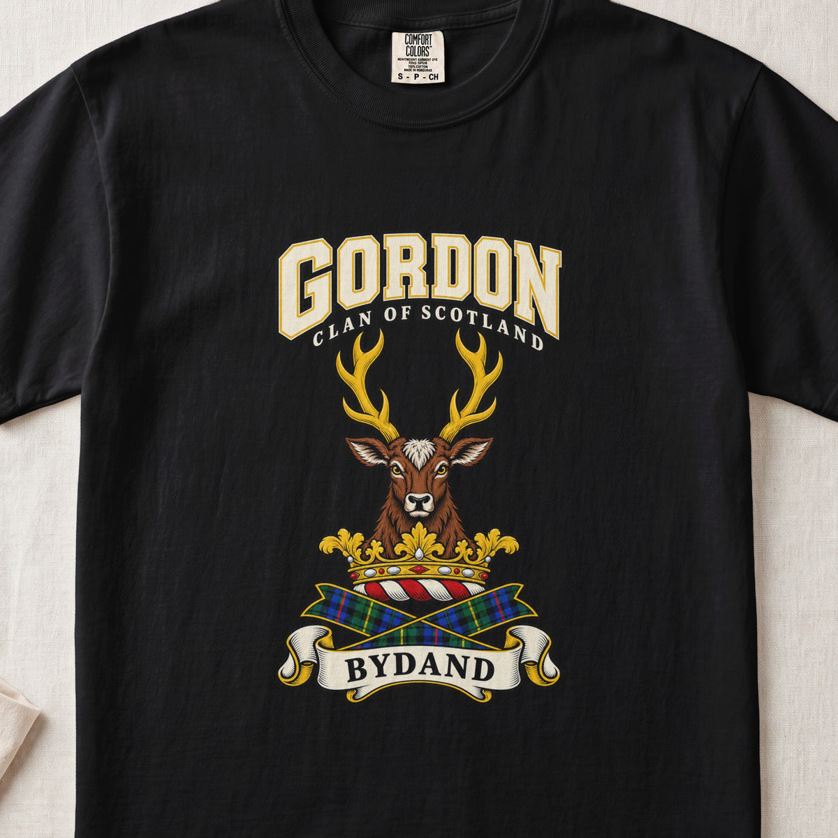Gordon graphic T-shirt in Black, front flat lay showing varsity lettering and forward-facing brown stag head with gold antlers.