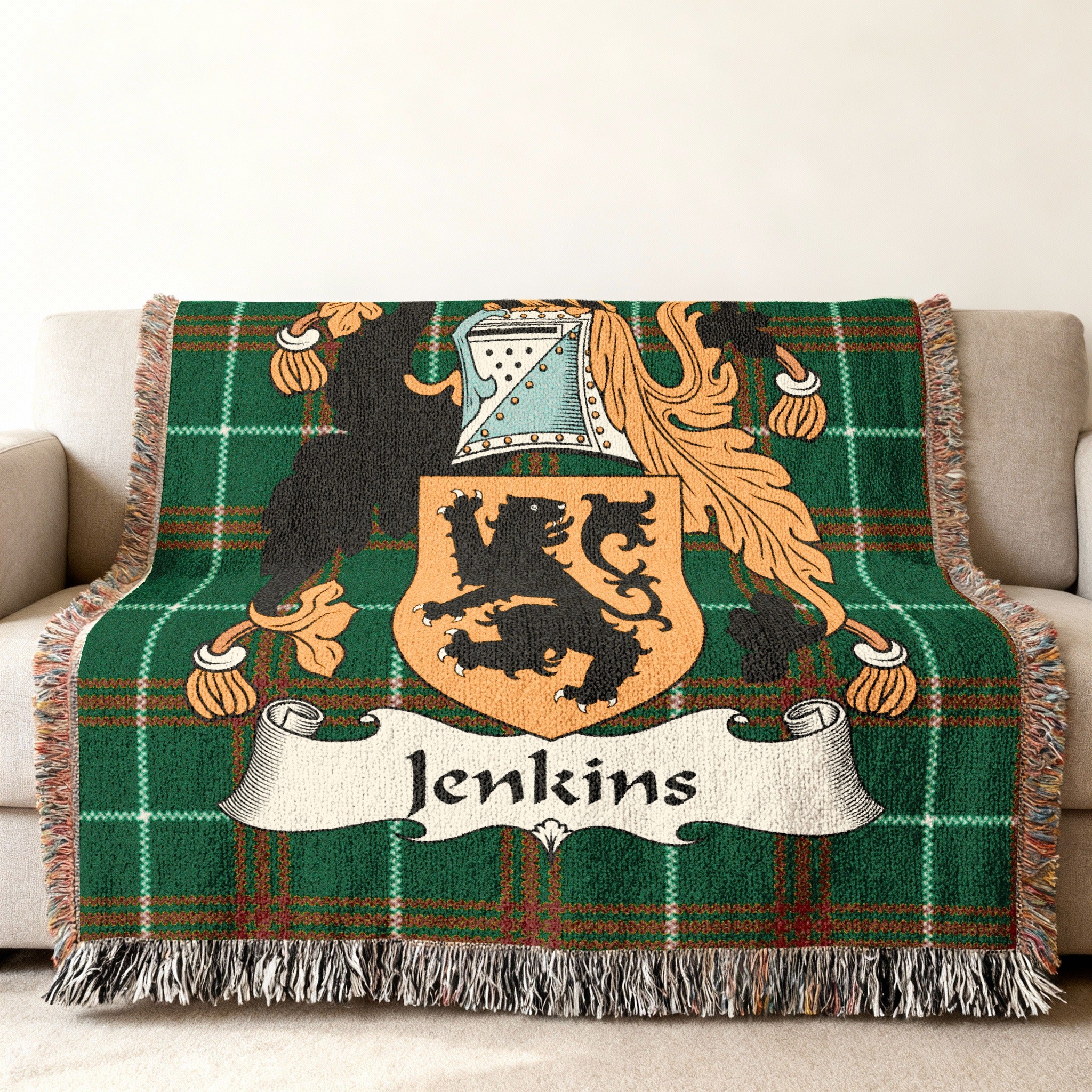Green tartan blanket with the Jenkins family crest in the center.