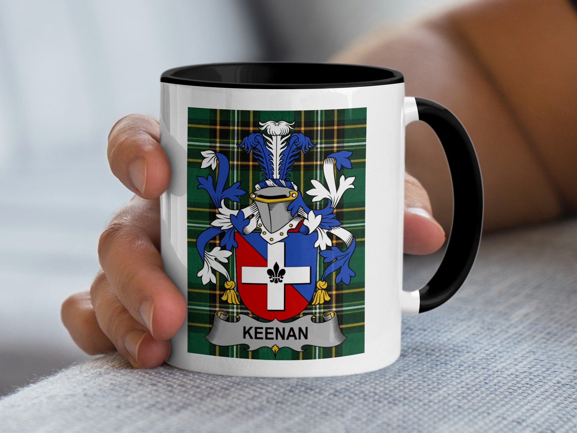 White mug with black handle displaying a crest with the name "KEENAN".