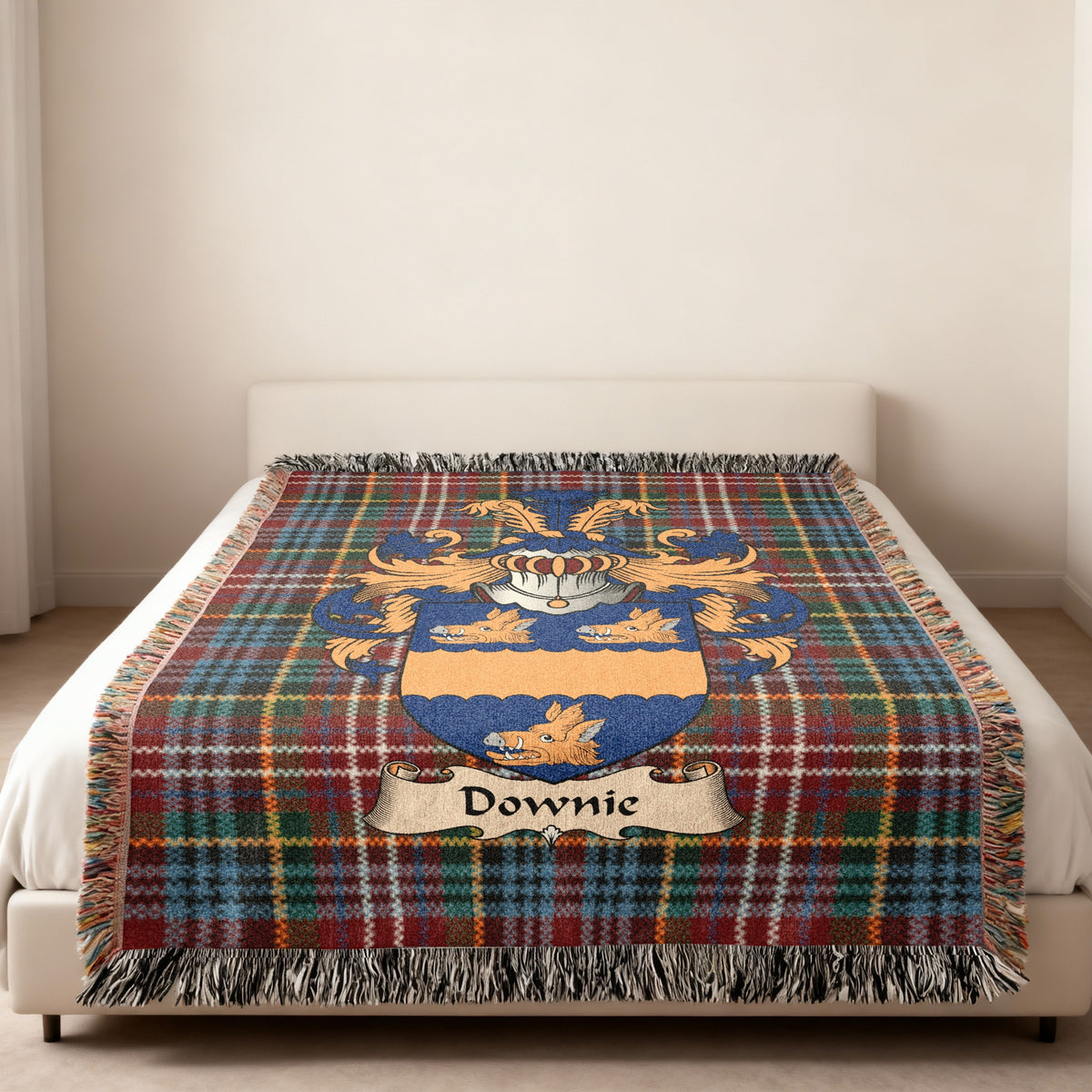 Downie Scottish family shield woven blanket on a Caledonia tartan background