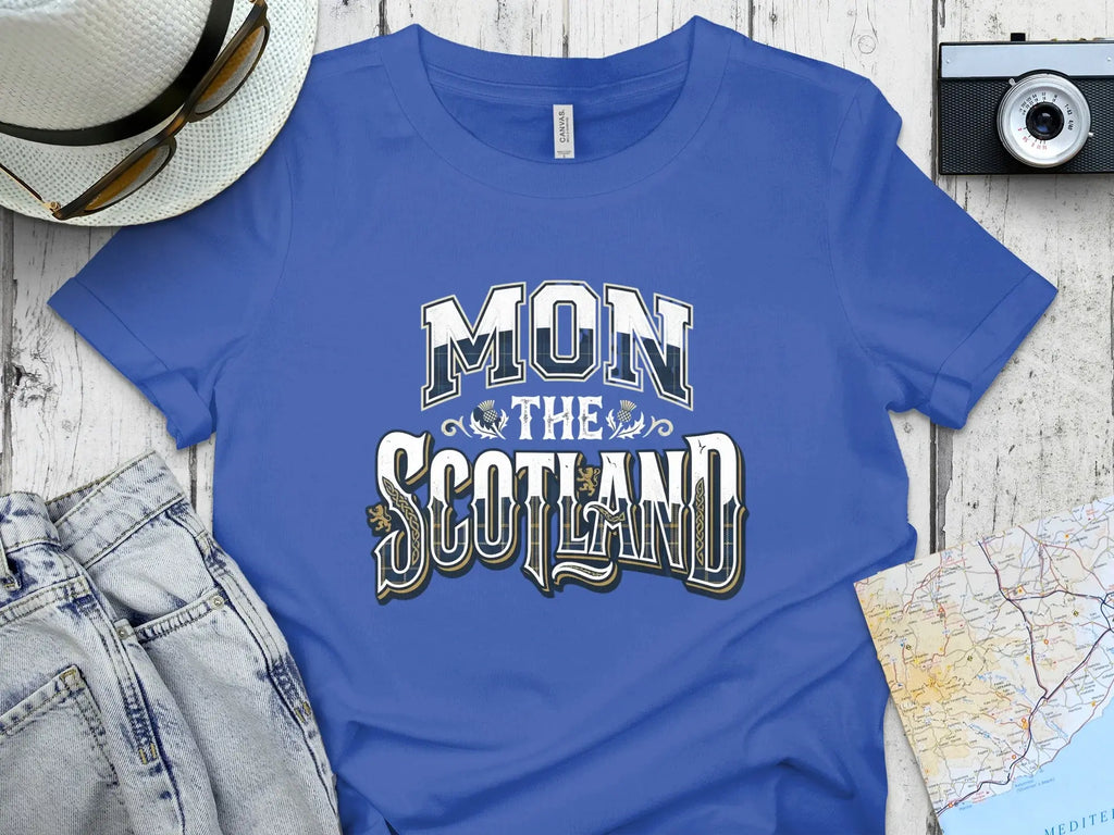 Blue t-shirt with "MON THE SCOTLAND" text.