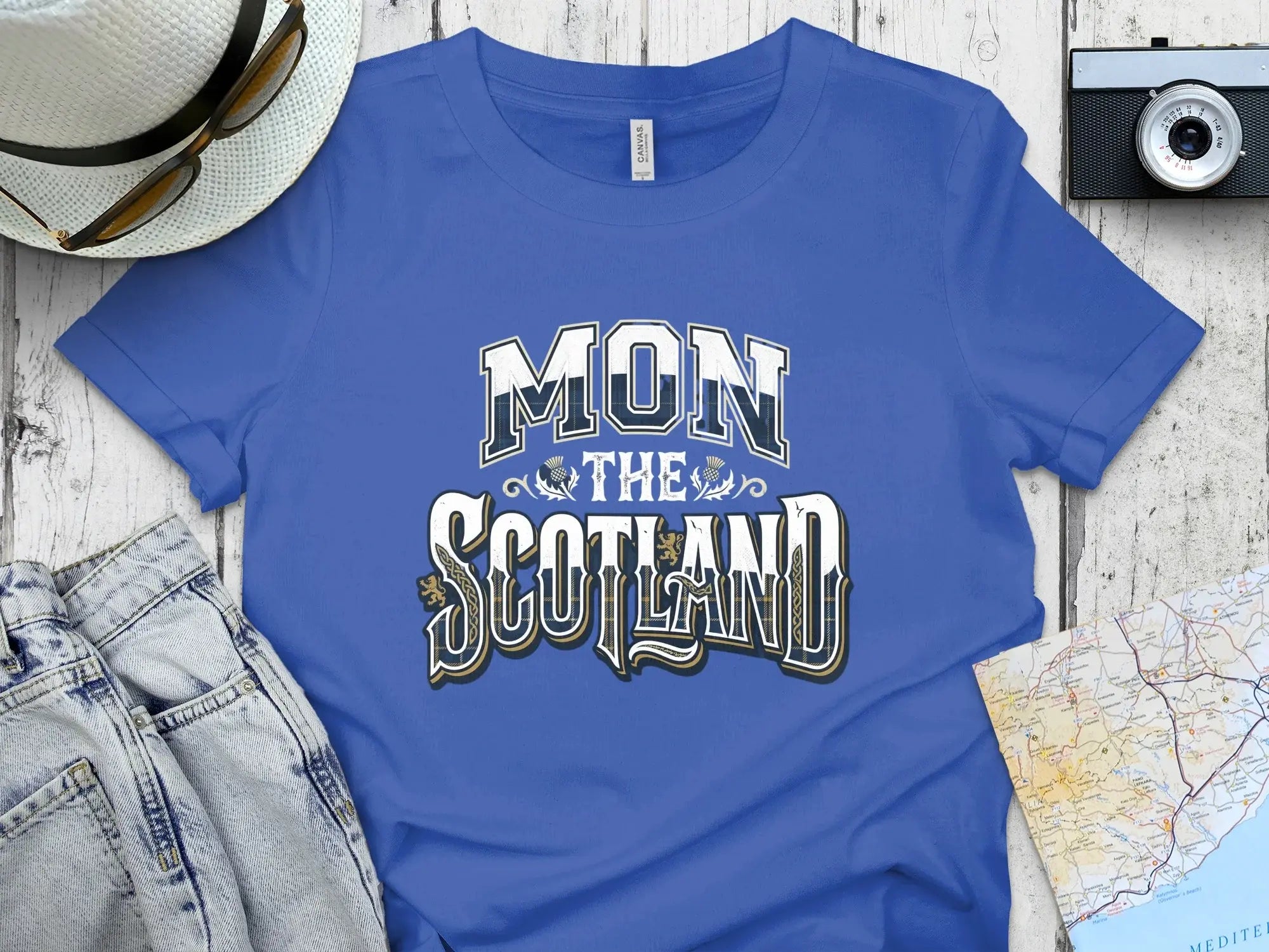 Blue t-shirt with "MON THE SCOTLAND" text.