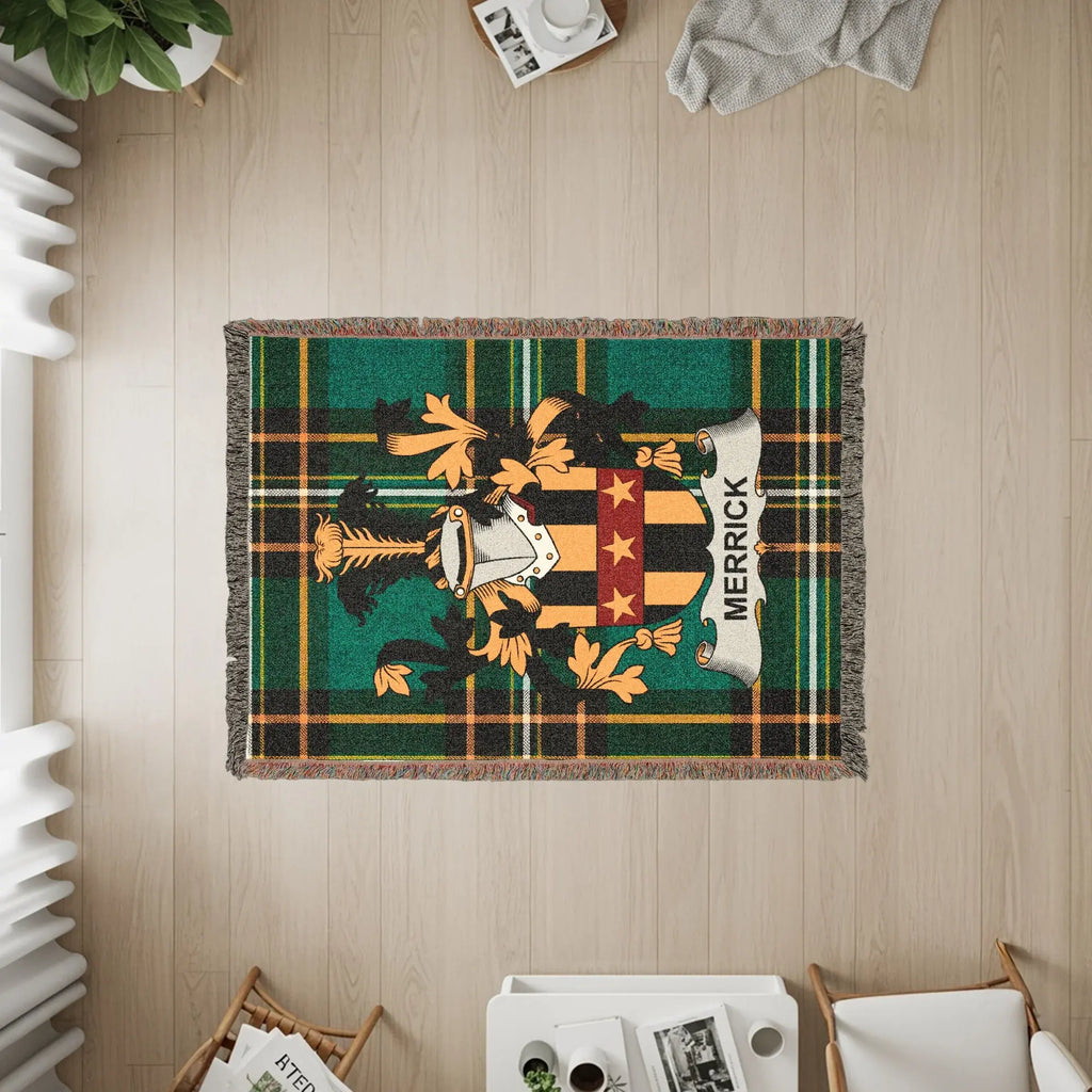 Merrick family crest on a green plaid woven blanket.