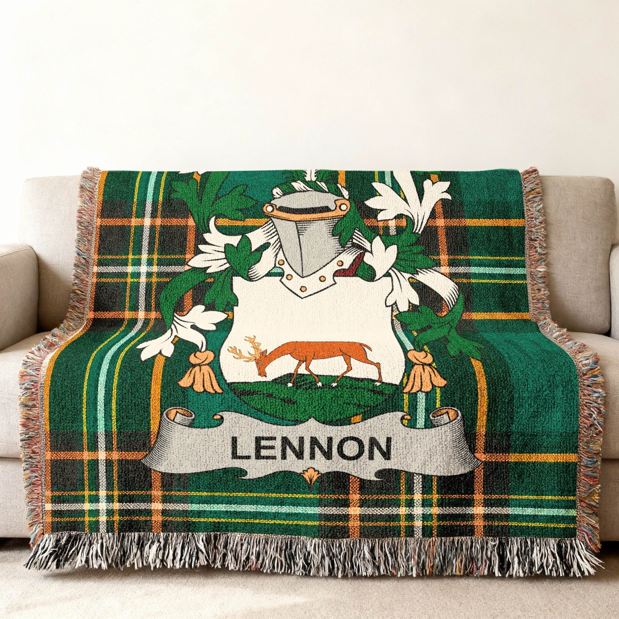 Green plaid throw blanket with white and green crest featuring a deer and "LENNON" text.