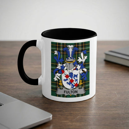 White mug with black rim featuring the Fulton family crest on a tartan background.