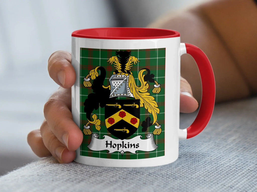 Hopkins Welsh tartan accent mug with red handle held in hand