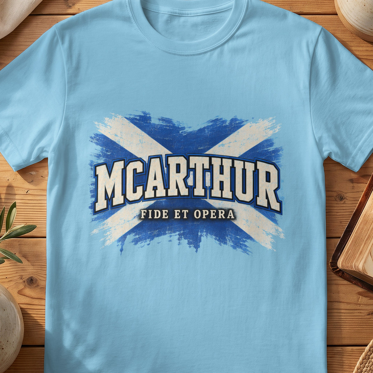 McArthur Scottish Saltire T-shirt in Sky, with distressed blue and cream flag and “Fide et Opera” lettering.