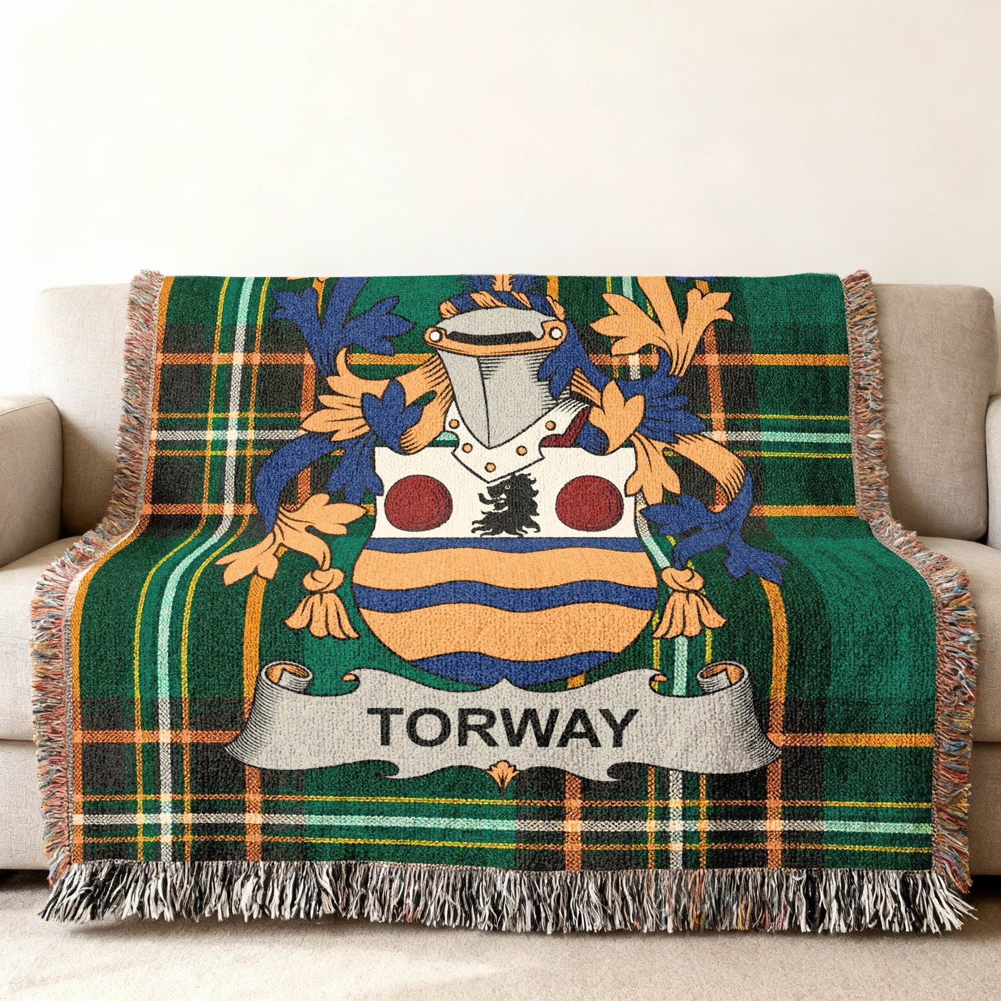 Tartan blanket featuring the Torway family crest in the center.