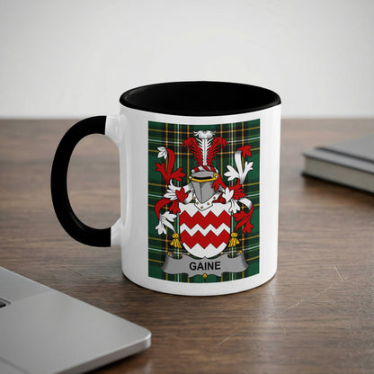White mug with black rim featuring the GAINE family crest with red and white chevrons.