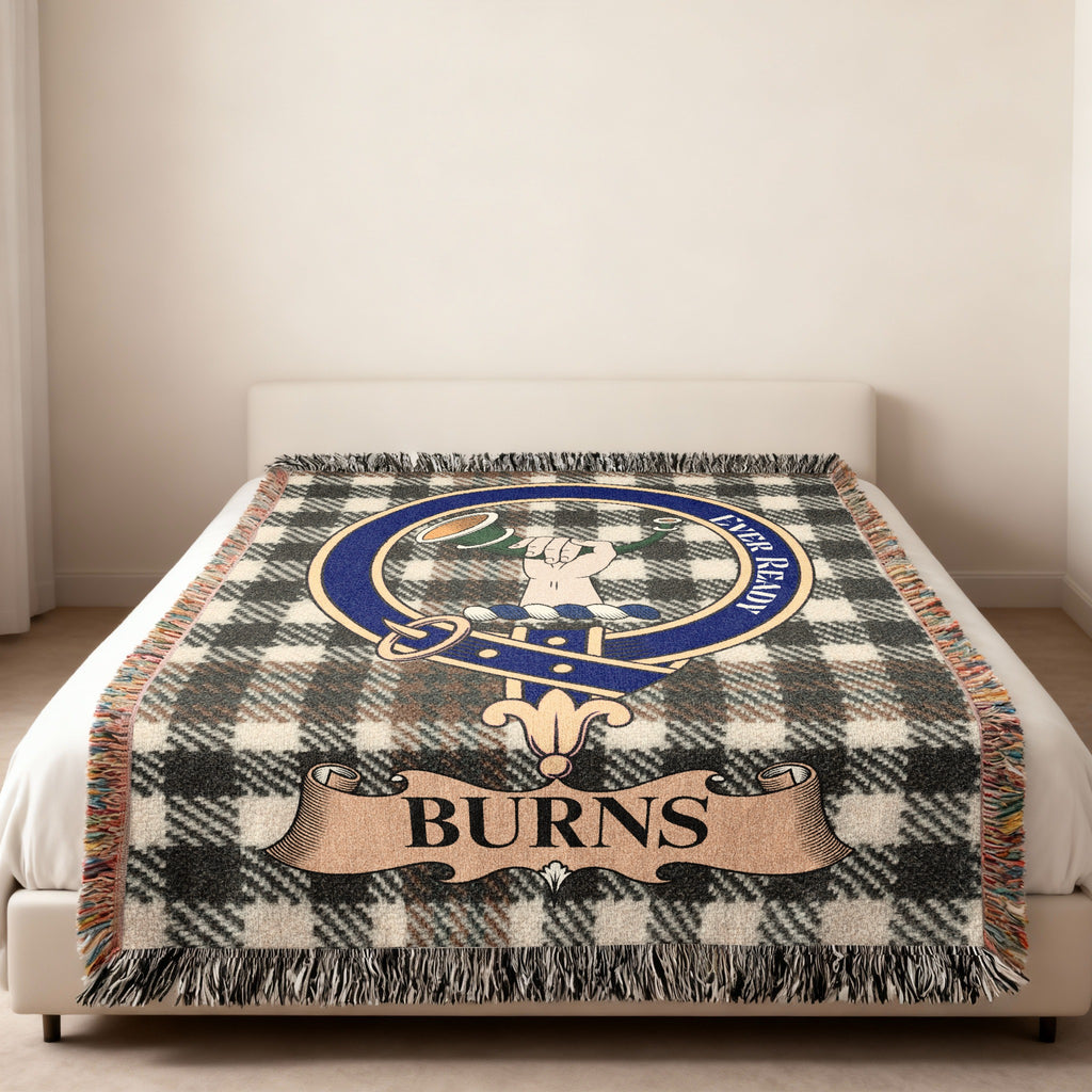 Burns family crest with hand and horn woven into tartan blanket