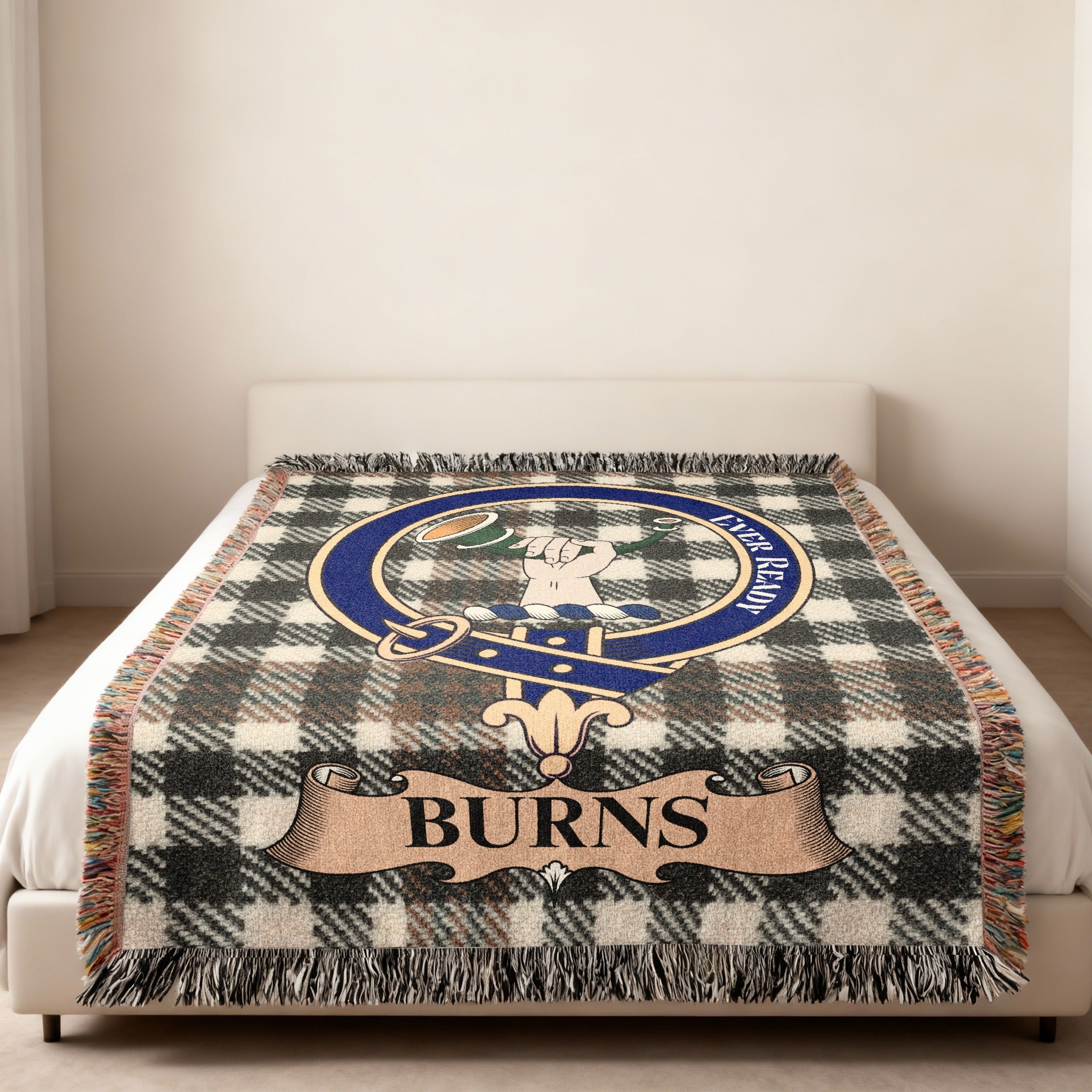 Burns family crest with hand and horn woven into tartan blanket