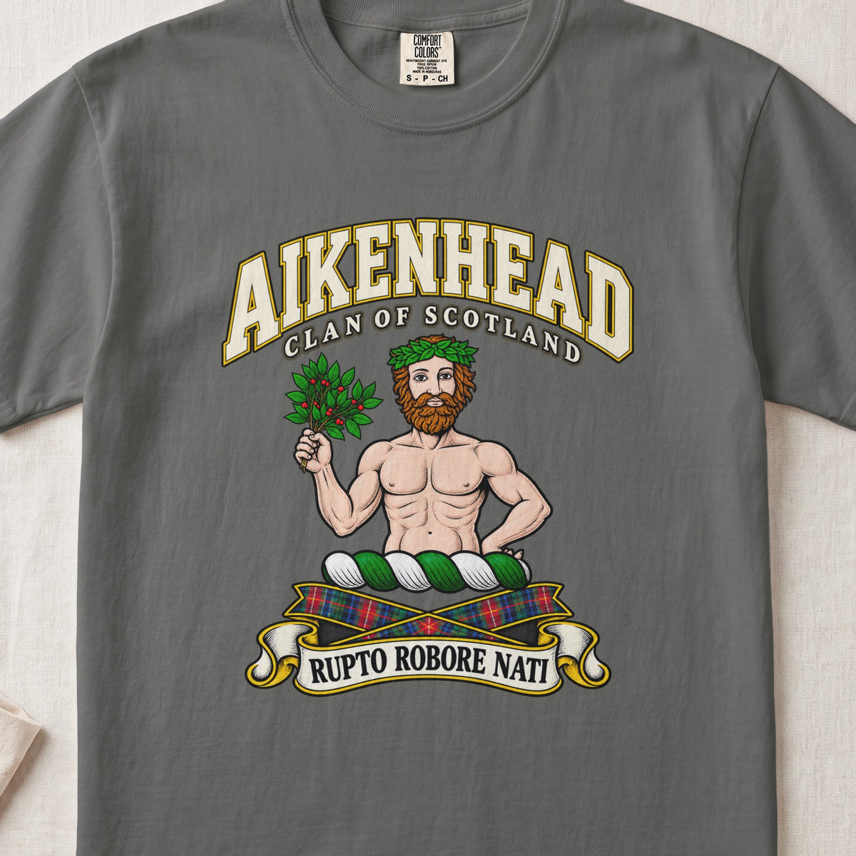 Aikenhead Scottish clan T-shirt in Pepper, front view with a bearded figure holding a leafy branch and motto banner.
