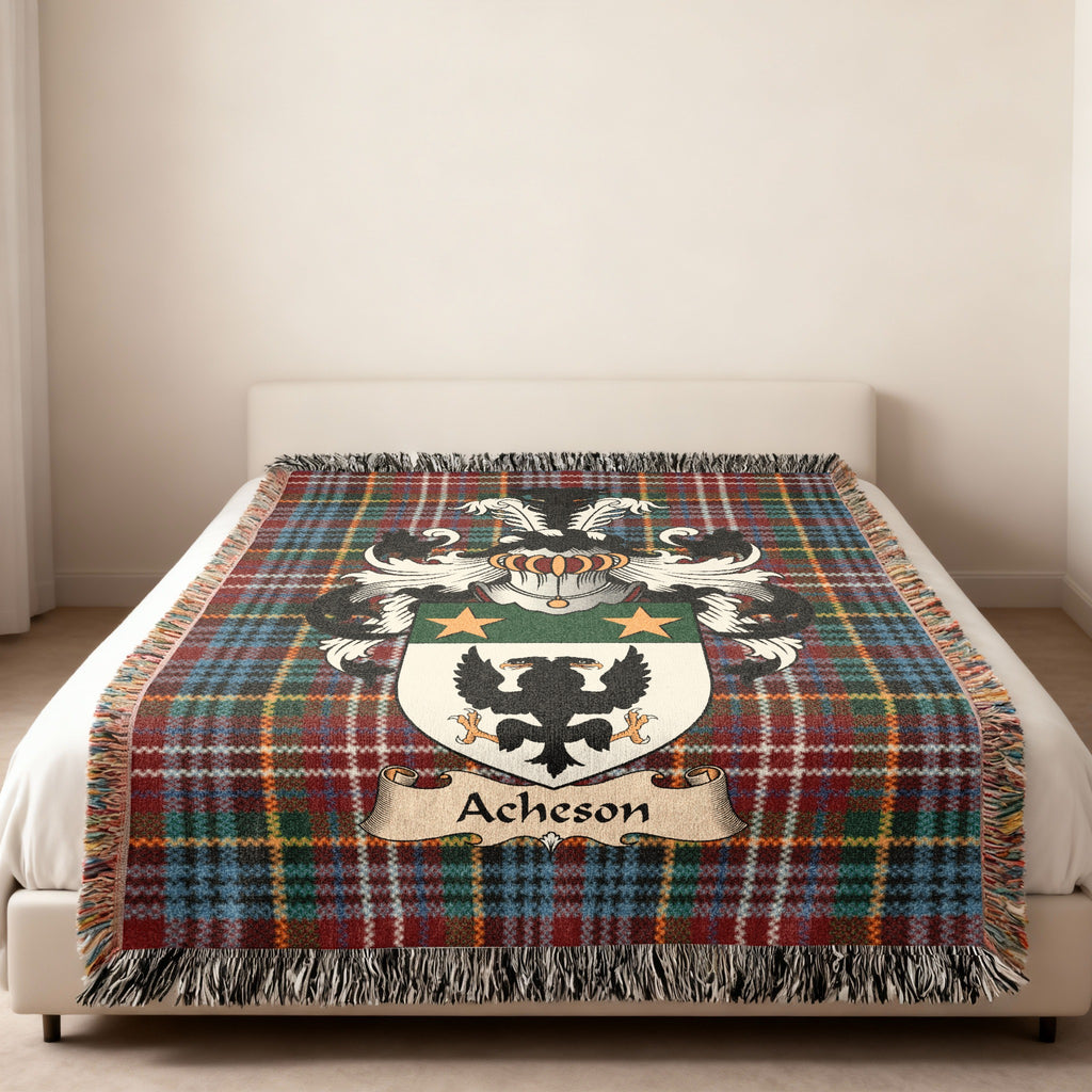 Acheson family crest emblem on a Caledonia tartan woven blanket