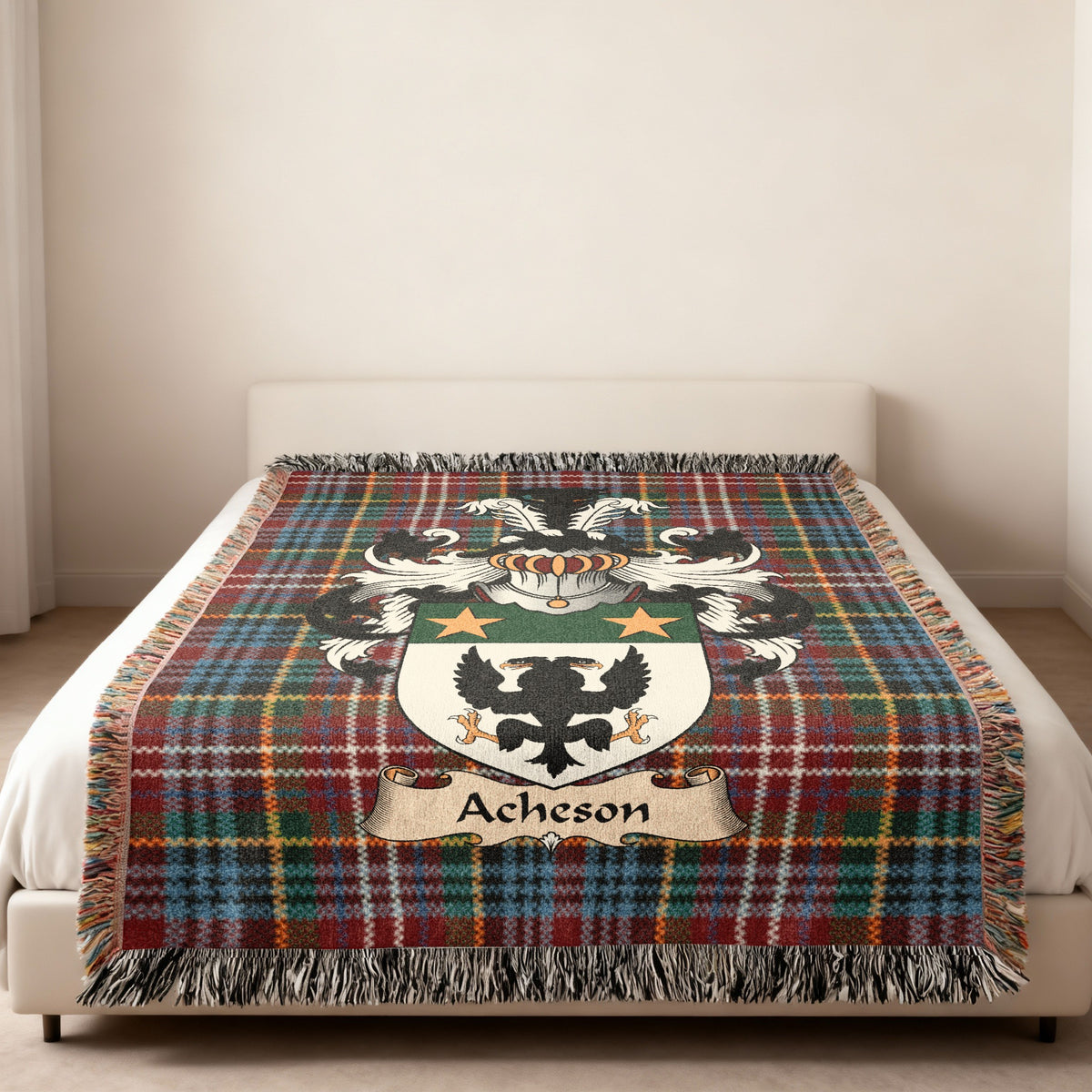 Acheson family crest emblem on a Caledonia tartan woven blanket