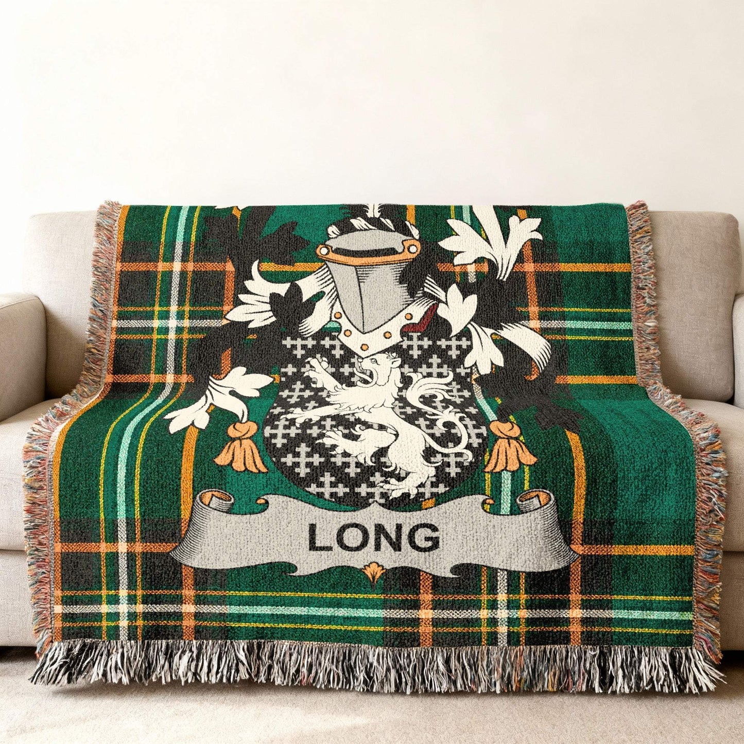 Woven blanket with green tartan and a family crest featuring the name "LONG".