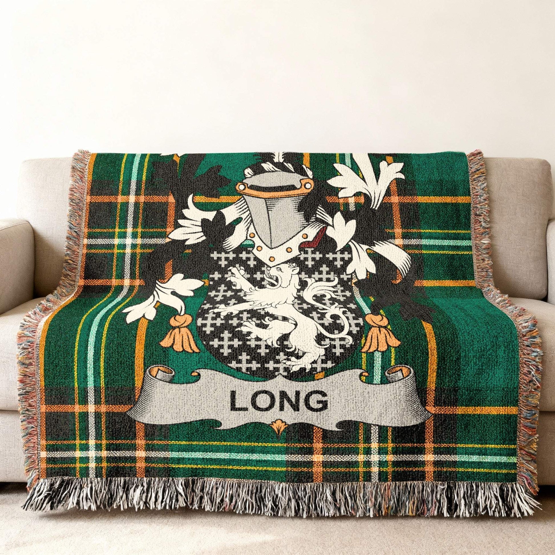Woven blanket with green tartan and a family crest featuring the name "LONG".