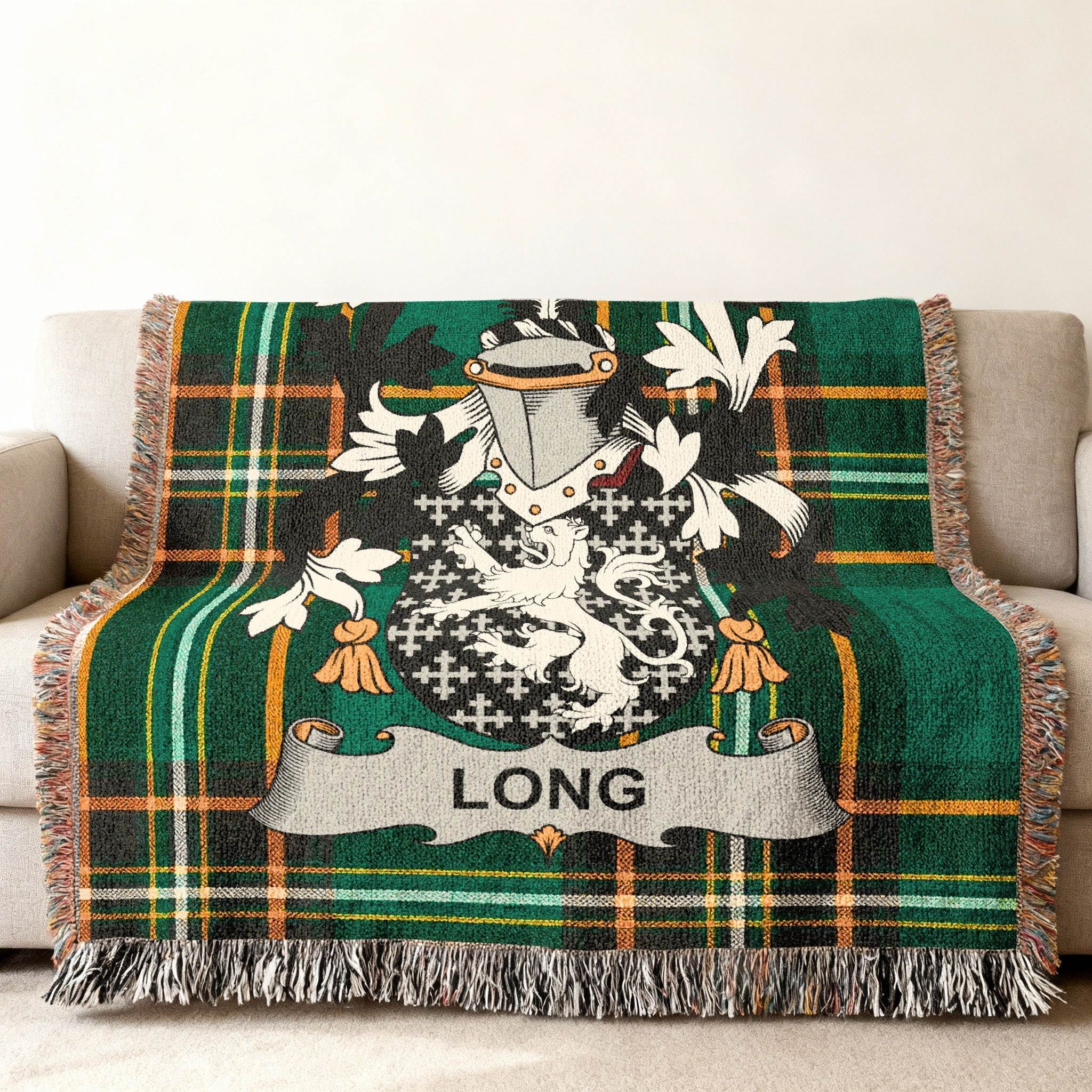 Woven blanket with green tartan and a family crest featuring the name "LONG".
