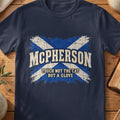 McPherson Scottish Saltire T-shirt in Navy, with distressed blue and cream flag and “Touch Not the Cat Bot a Glove” lettering.