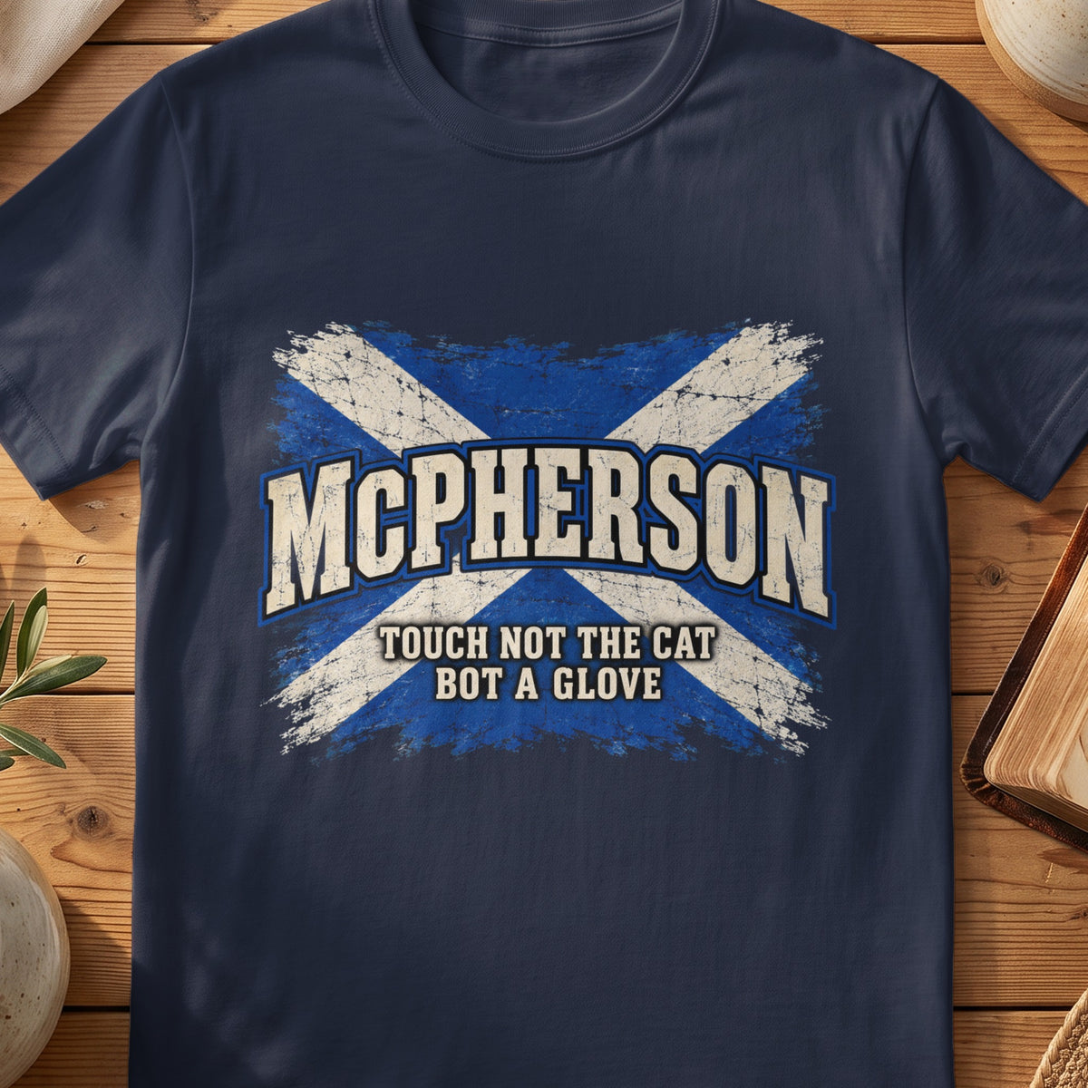 McPherson Scottish Saltire T-shirt in Navy, with distressed blue and cream flag and “Touch Not the Cat Bot a Glove” lettering.